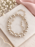 Set de Pulseras Plateadas con Perlas – Elegancia Atemporal